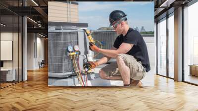 Hvac tech looking at a  multimeter Wall mural