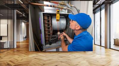 Hvac Technician checking voltage on a blower motor Wall mural