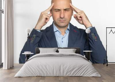 Bald man is having a headache isolated on white Wall mural