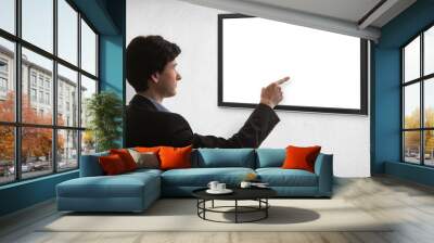 Businessman looking on the empty screen. back view Wall mural