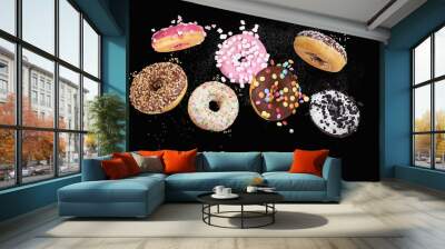 colorful donuts on black background Wall mural