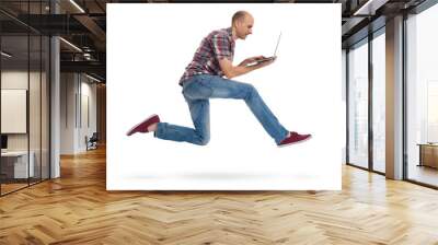 man running with a laptop isolated on white background Wall mural