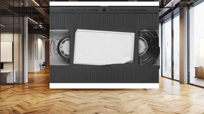 Old vintage vhs video cassette tape with a blank paper label. Magnetic videotape movie storage Wall mural