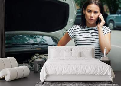 young woman with a broken car Wall mural