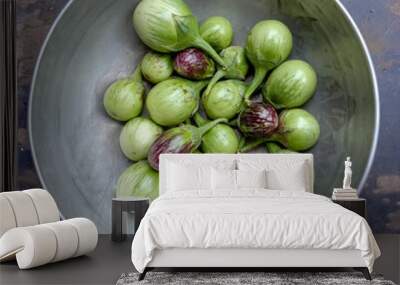 green organic brinjals in a bowl. Wall mural