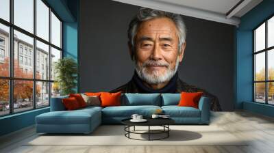 Asian 60-70 years old man with grey hair and beard against dark gray background with copy space Wall mural