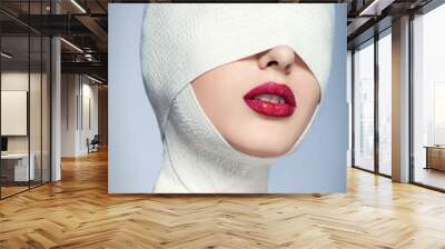 Beautiful woman after plastic surgery with bandaged face Wall mural