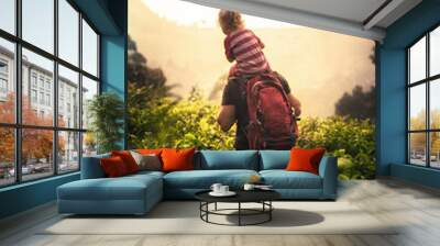 Family travelling lifestyle with father traveler and child daughter piggy back exploring tropical thickets in the mountains during vacation  Wall mural