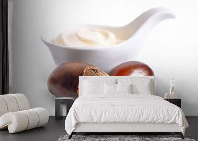 Shea nuts with butter or cream in the bowl. Isolated on white ba Wall mural