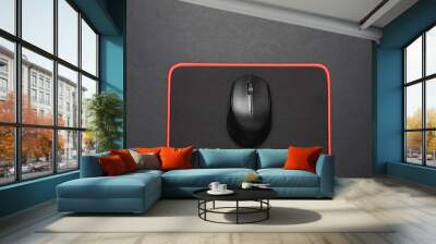 Black PC mouse with PC mouse pad on a black background Wall mural