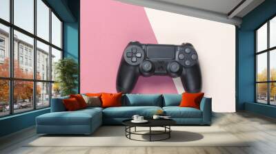 Gamepads on a colored paper background. Top view. Minimalism. Wall mural