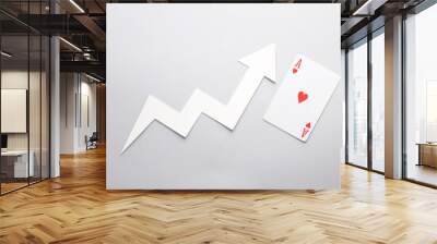 Growth arrow with ace of hearts on gray background Wall mural