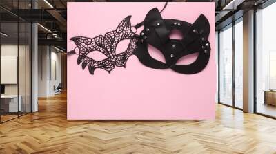 Lace and leather cat mask on a pink background. Romantic, love concept Wall mural