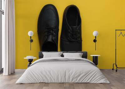 Men's leather black shoes on paper background. Top view Wall mural