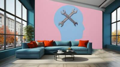 Paper-cut head and wrenches on pink background. Mental health, treatment Wall mural