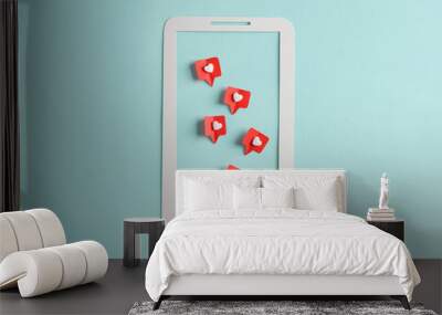 Paper cut smartphone with Social media likes on blue background. Creative minimal layout Wall mural