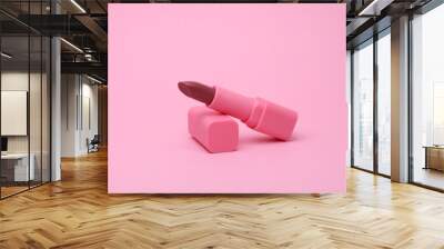 Pink lipstick tube on pink background Wall mural