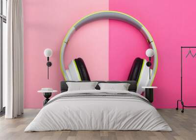 Stylish wireless stereo headphones on pink pastel background. Music lover. Gadgets. Top view. Wall mural