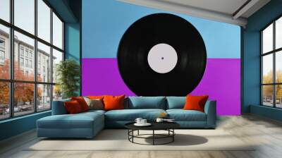 Vinyl plate on a colored background, retro music technology, top view, minimalism. Wall mural