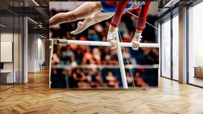 close-up body part female gymnast exercise on uneven bars in artistic gymnastics, sports summer games Wall mural