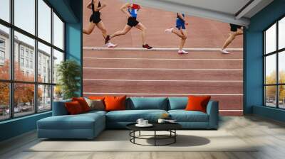 four athletes run 800 meters at stadium, athletics competition Wall mural