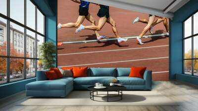 group athletes running 800 meters at stadium Wall mural