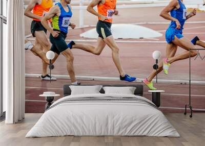 group runners athletes on middle distance run stadium Wall mural