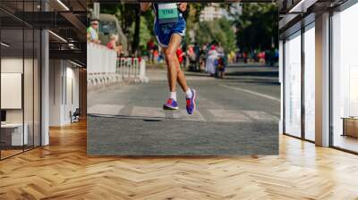 male athlete runner run marathon race in city Wall mural