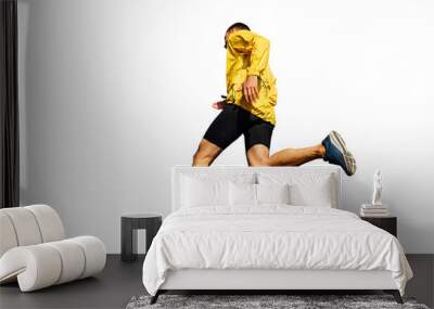 male runner in yellow jacket running Wall mural