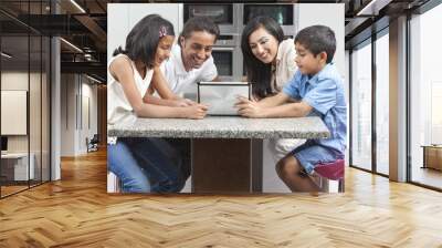 Asian Indian Family Using Tablet Computer at Home Wall mural