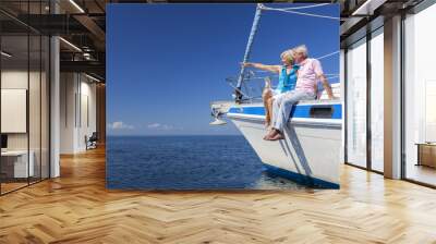 Happy Senior Couple Sailing on a Sail Boat Wall mural