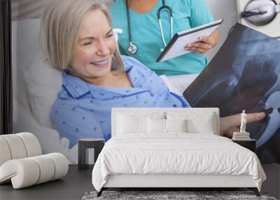 Happy Senior Woman Patient in Hospital Bed Wall mural