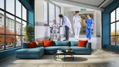 senior female patient in wheelchair & doctor in hospital Wall mural