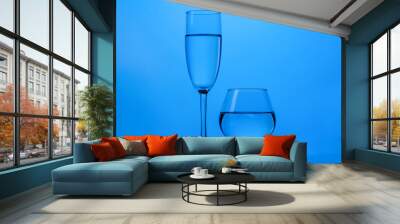 There are glasses of liquid. Wall mural