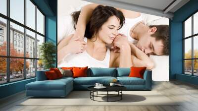 Young couple having breakfast in bed. Wall mural