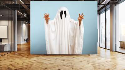 Child dressed up in white costume of scary ghost for Halloween Wall mural