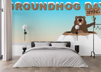 groundhog shows a tablet with an inscription spring peeping out of a hole. groundhog day Wall mural