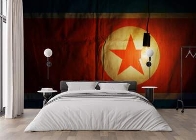 North Korean flag lit by a lamp Wall mural