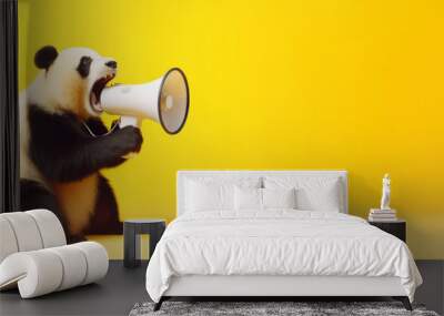 Panda with loudspeaker on yellow background Wall mural