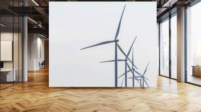 Wind farm. Wind Turbines in wind farm against sky. Energy conservation concept. Producing alternative energy Wall mural