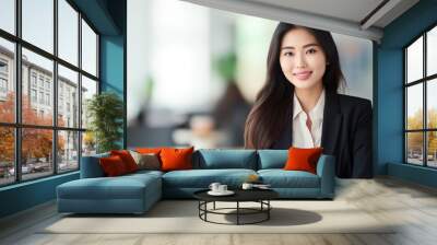 Portrait of a beautiful young Asian businesswoman at the company Wall mural