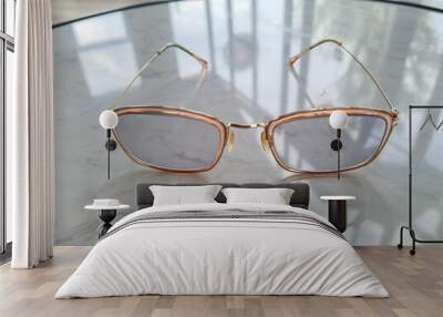 The glasses are placed on the marble table. Wall mural