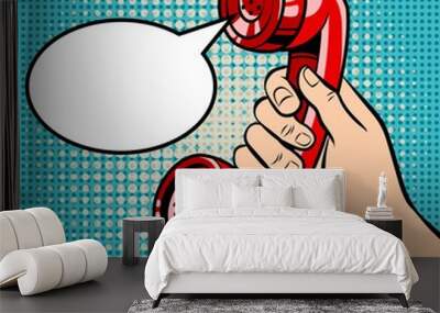 Hand holding red phone handset and empty speech bubble. Pop art vector retro illustration. Wall mural