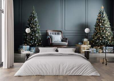 Near a chair and a dusty blue textured wall is a Christmas tree with gifts. living room is empty. a mock-up of a wall scene Wall mural