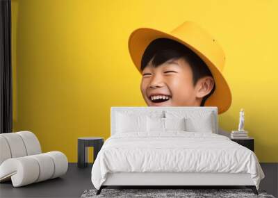 Cute little asian boy laughing and smiling wear hat Wall mural