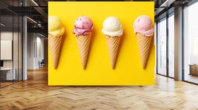 Ice cream cones with various flavors on a yellow background Wall mural