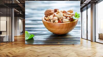 Wooden bowl with mixed nuts Wall mural