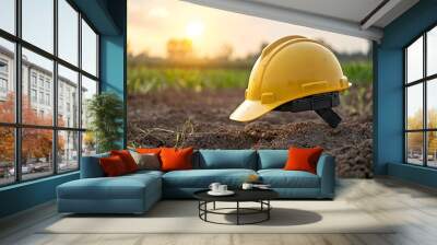 Close up of an engineer s hard hat placed on a clean energy production site glowing softly with warm bokeh lighting that symbolizes innovative and sustainable construction projects Wall mural