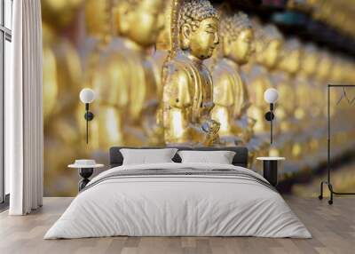 gold buddha statue on wall Wall mural