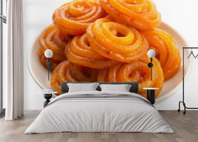 Jalebi indian sweets on white plate Isolated on transparent background Wall mural